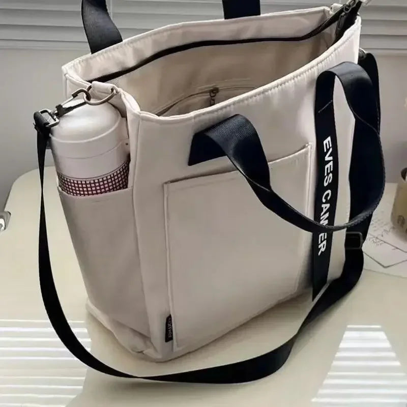 Nova Mala de Ombro Casual de Grande Capacidade em Nylon Impermeável de Lona, ​​Bolsa de Mão Simples e Moderna para Estudantes