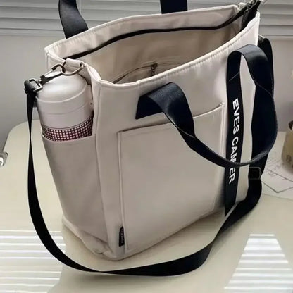 Nova Mala de Ombro Casual de Grande Capacidade em Nylon Impermeável de Lona, ​​Bolsa de Mão Simples e Moderna para Estudantes