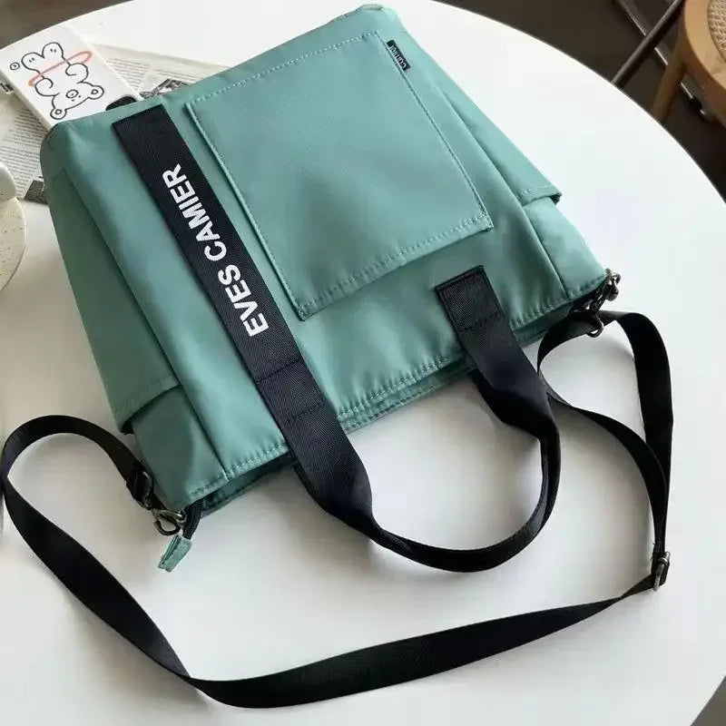Nova Mala de Ombro Casual de Grande Capacidade em Nylon Impermeável de Lona, ​​Bolsa de Mão Simples e Moderna para Estudantes