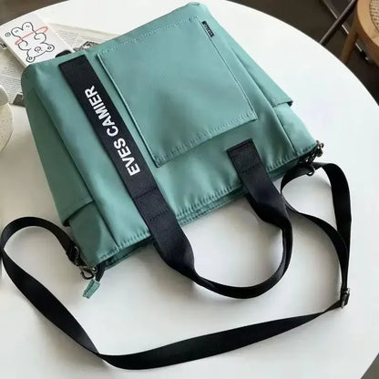 Nova Mala de Ombro Casual de Grande Capacidade em Nylon Impermeável de Lona, ​​Bolsa de Mão Simples e Moderna para Estudantes