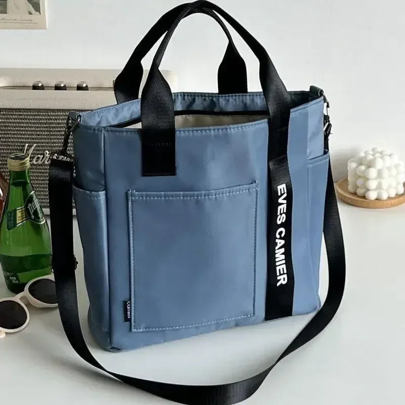 Nova Mala de Ombro Casual de Grande Capacidade em Nylon Impermeável de Lona, ​​Bolsa de Mão Simples e Moderna para Estudantes